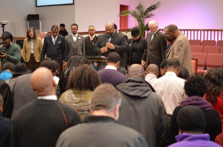 Mayor Finch joins prayer gathering at close of meeting.