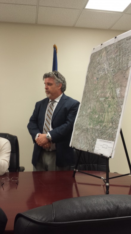 Chief of Staff Danny Roach addresses City Council members next to map of Fairchild Wheeler golf course.