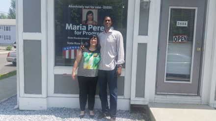 Maria Pereira with friend from high school, basketball legend Charles Smith.